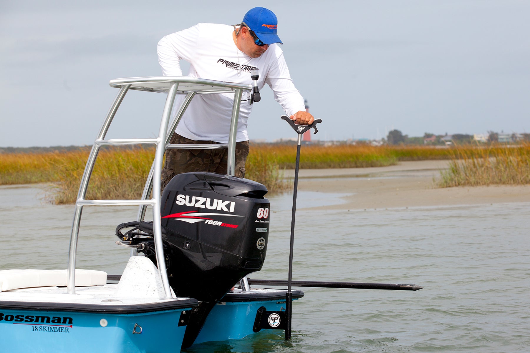 Man Anchoring In Shallow Water