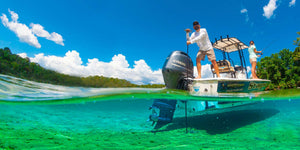 Photo of a couple on boat anchoring their boat with Stayput's Pole Anchor